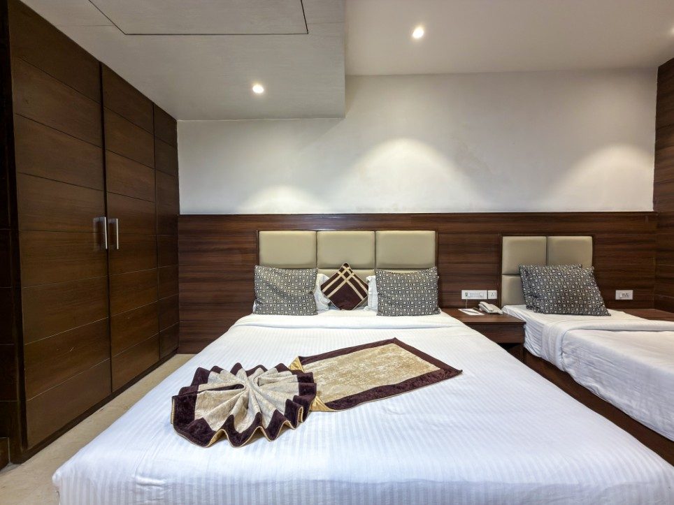 The wardrobe wall and beds of the Executive Triple Room, Hotel Sawera Grand