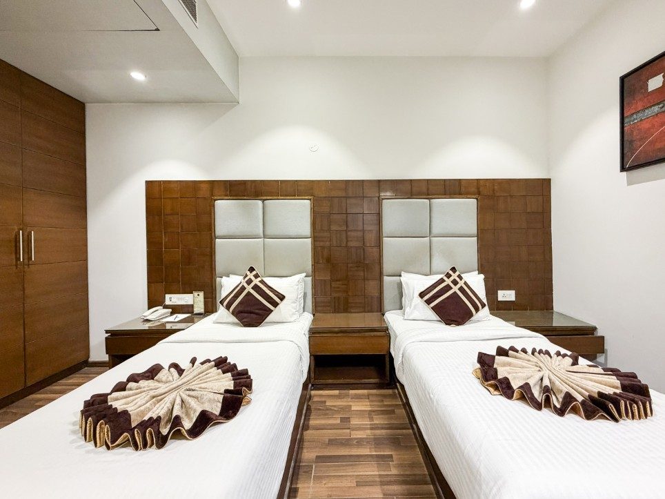 Two separate single beds in the Executive Twin Room, Hotel Sawera Grand, Amritsar